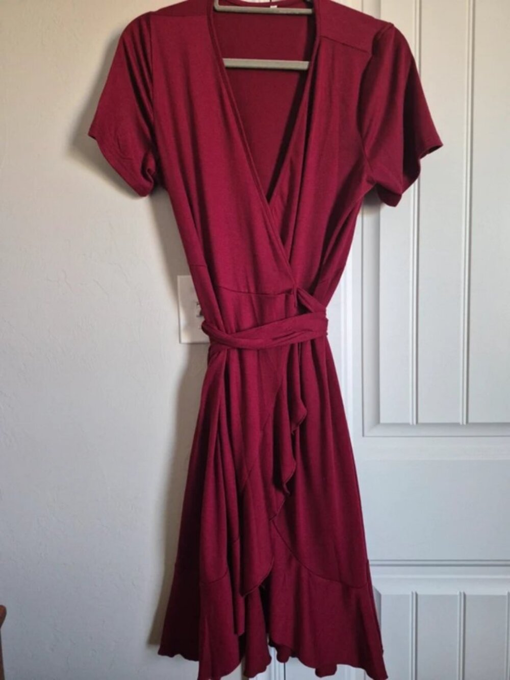 Woman's short skeeve wrap style burgundy dress